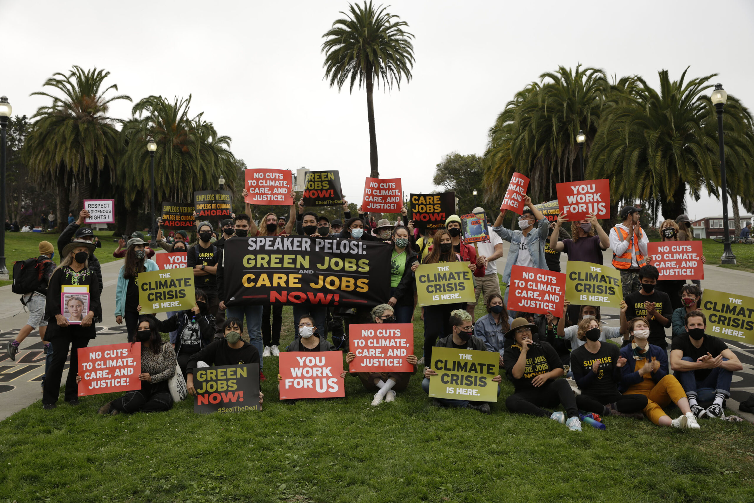 Organizers of the California Green New Deal coalition hold up demands